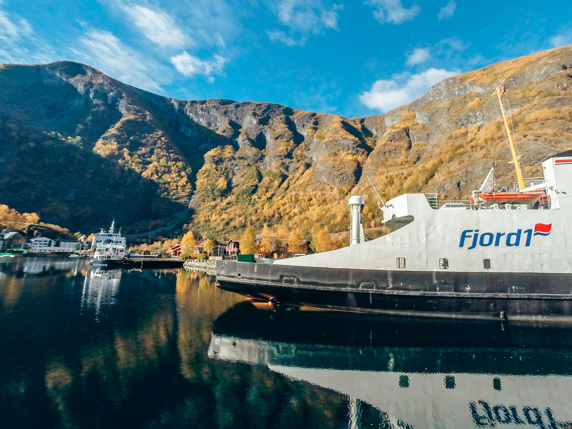 Ferry on the fjord near Flåm with mountains in the background